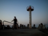 Lighthouse and walker at dusk, Herzlia Marina, 2003